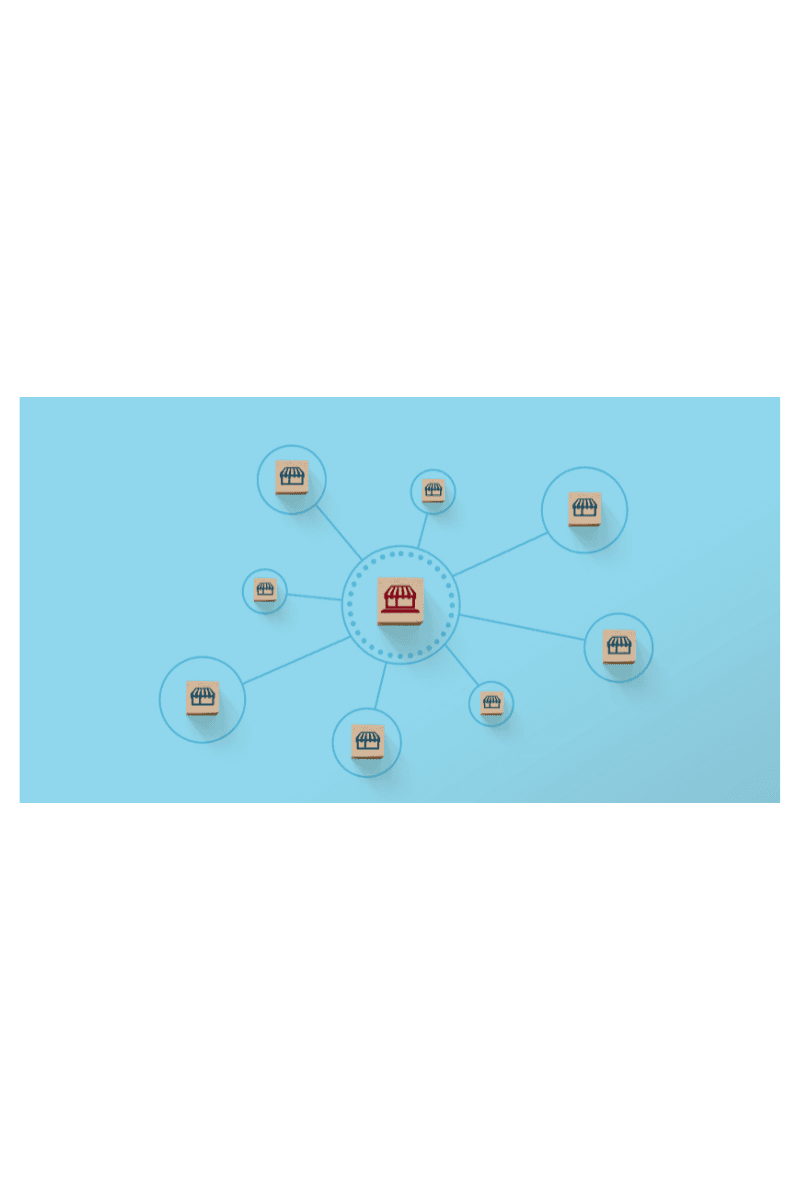 Wooden blocks with storefront icons linked to a central red storefront, illustrating a franchise network branching from one brand.